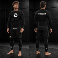 Adult wearing the full branded Gymnasia long-sleeve No-Gi set with shorts over tights, front and back