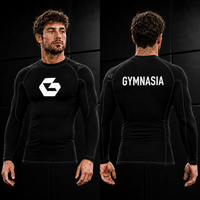 Adult wearing the branded Gymnasia long-sleeve rashguard, front and back