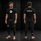Adult wearing the full branded Gymnasia short-sleeve No-Gi set with shorts over tights, front and back