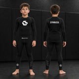 Child wearing the branded Gymnasia long-sleeve rashguard with tights, front and back