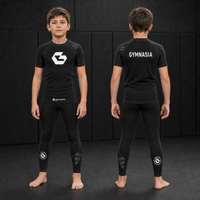 Child wearing the branded Gymnasia short-sleeve rashguard with tights, front and back