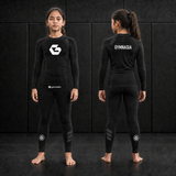 Girl wearing the branded Gymnasia long-sleeve No-Gi set, front and back