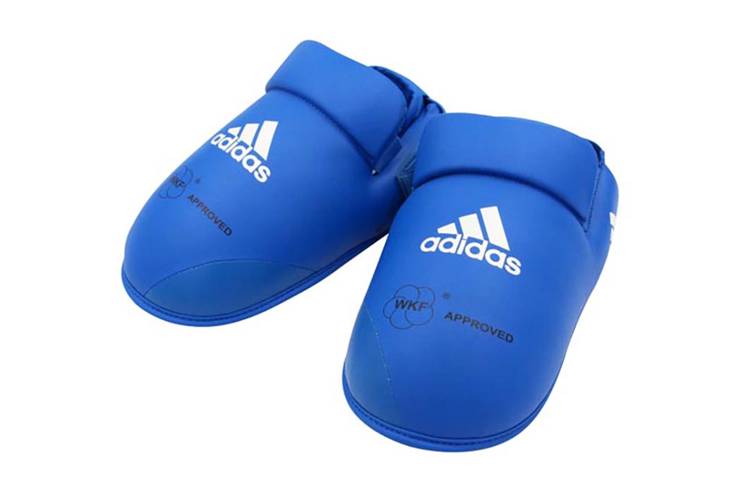 Detail of Adidas logo and velcro strap on karate foot pads