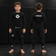 Child wearing the full branded Gymnasia long-sleeve No-Gi set with shorts over tights, front and back